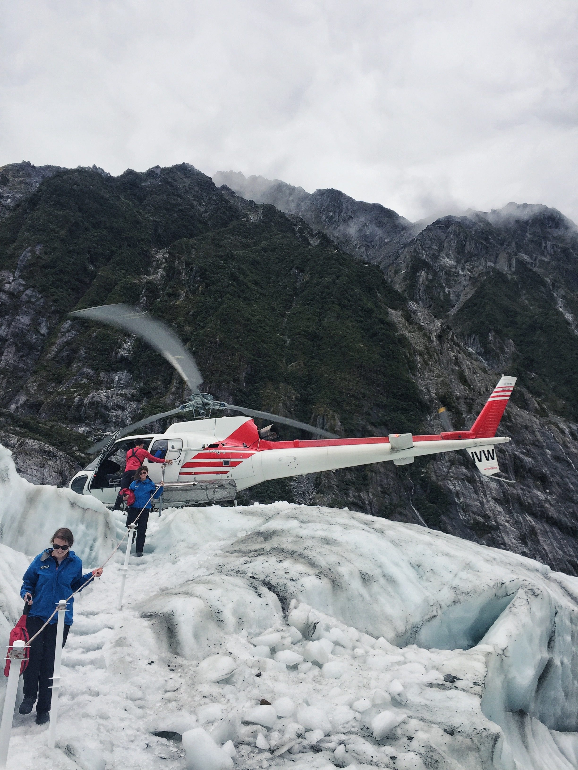 helicopter landing on franz josef glacier, new zealand