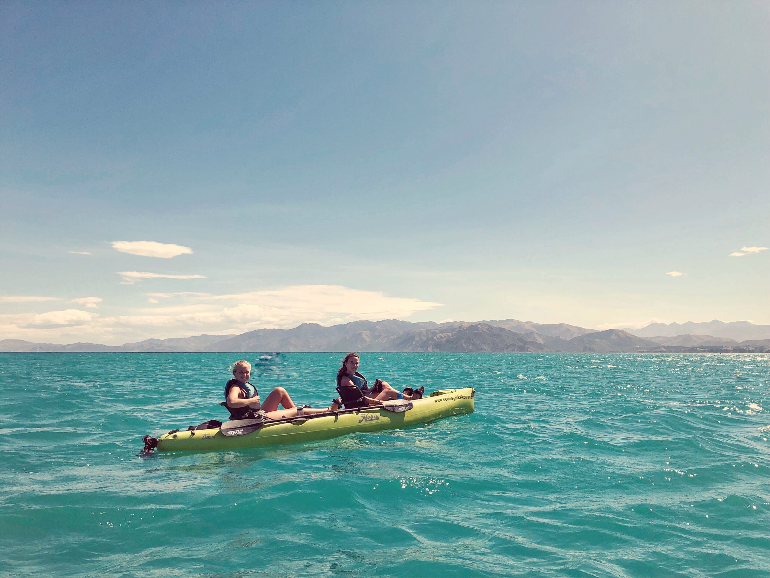 melody and friend kayaking in kaikoura, new zealand