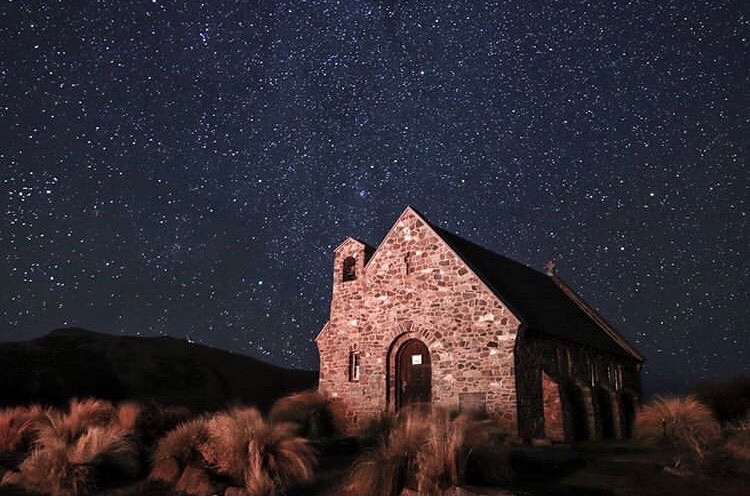 church of good hope at night- lots of stars in sky, lake tekapo, new zealand