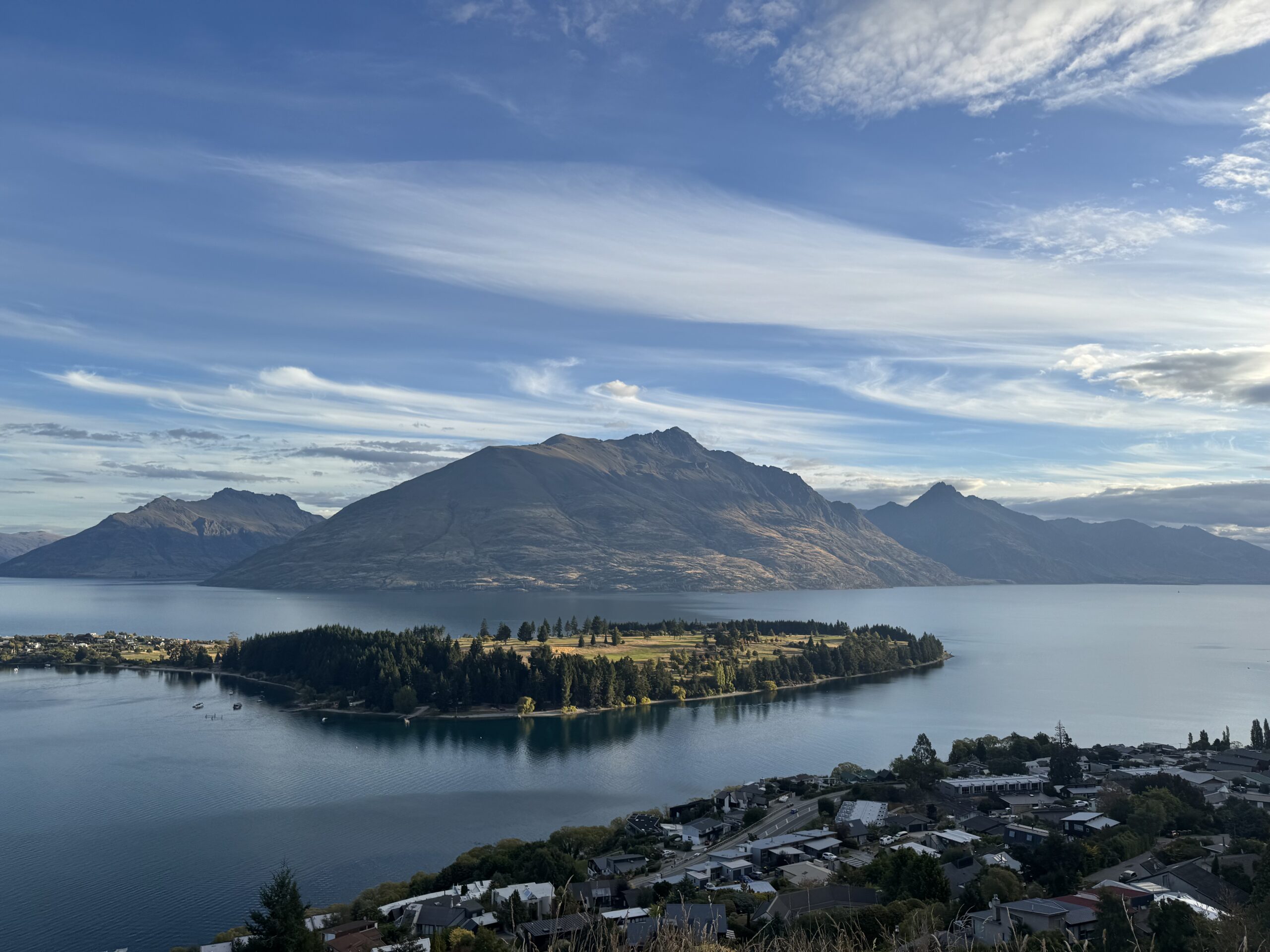 view of queenstown, new zealand take from above. houses, lake and mountains