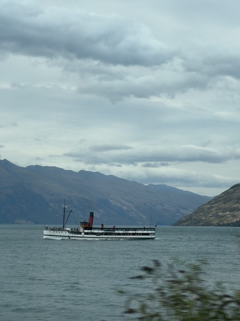 steamship on lake in queenstown, new zealand