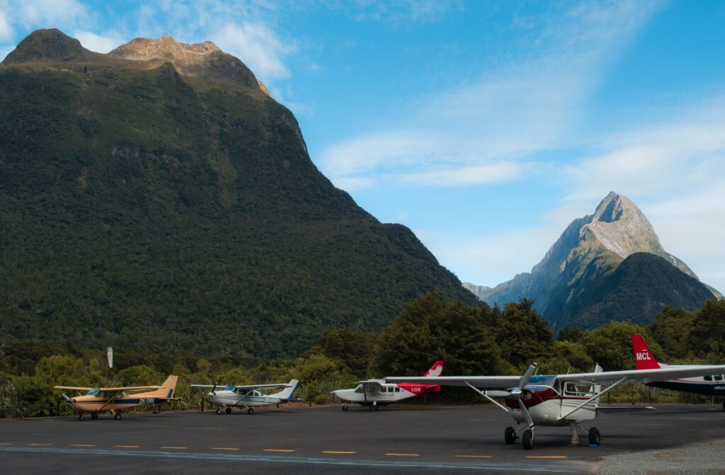 planes parked at milford sound, new zealand.