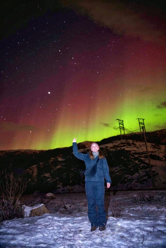 melody in front of northern lights, tromso, norway