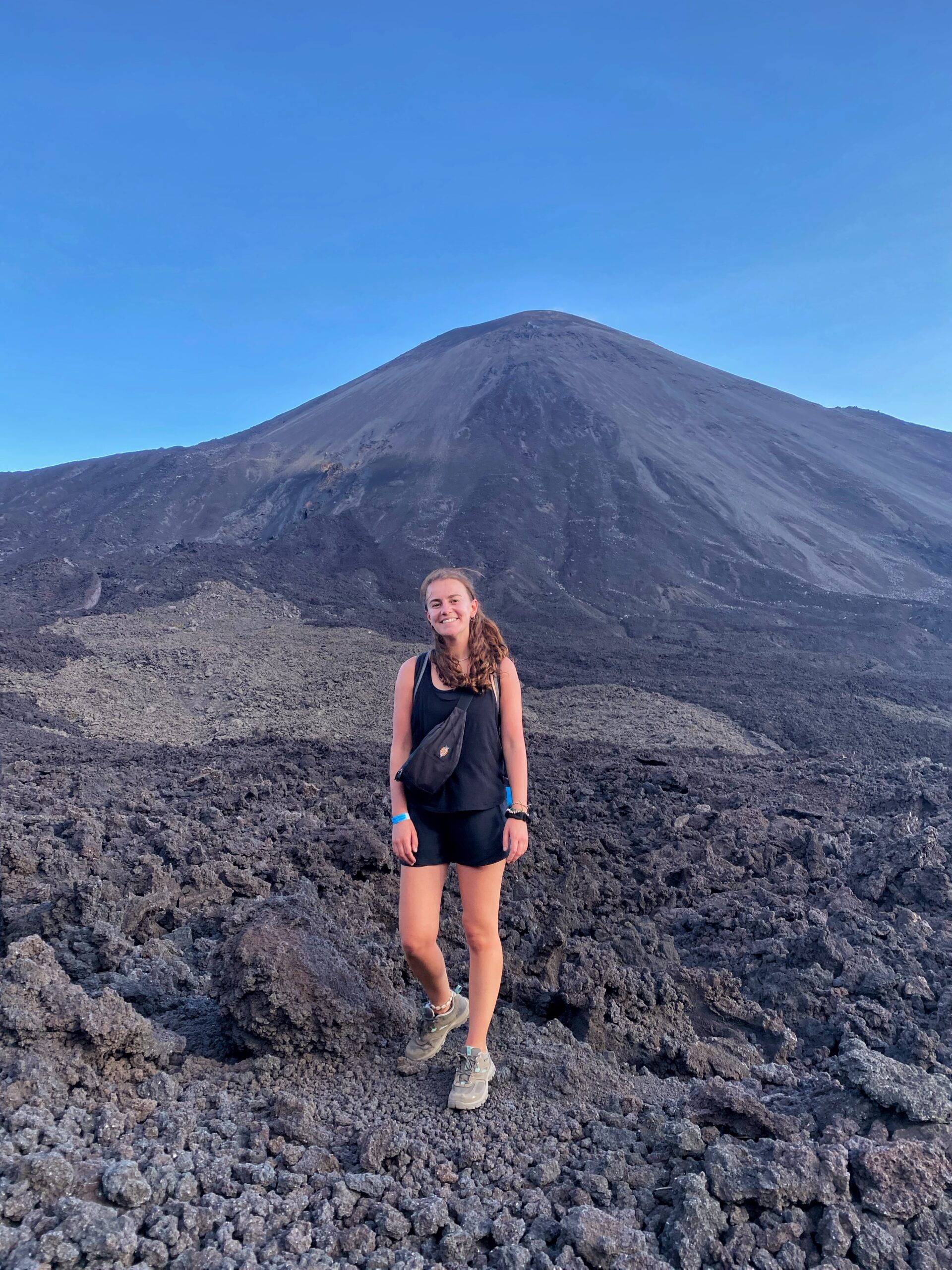 melody standing in front of volcano, guatemala