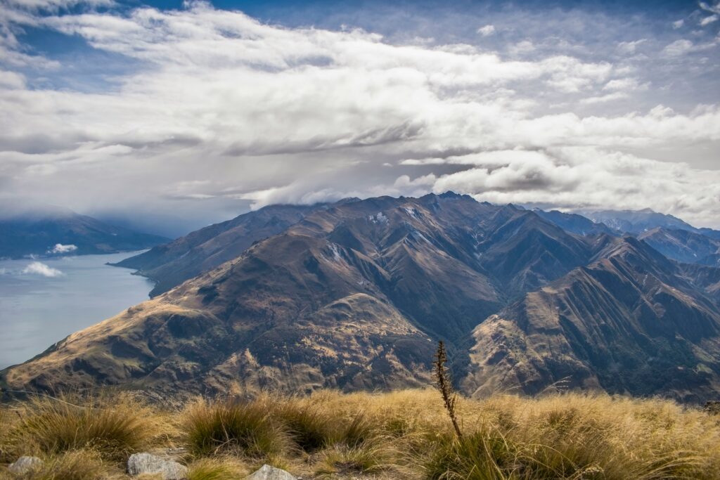 view from isthmus peak, wanaka, new zealand. viewpoint surrounded by lake and mountains