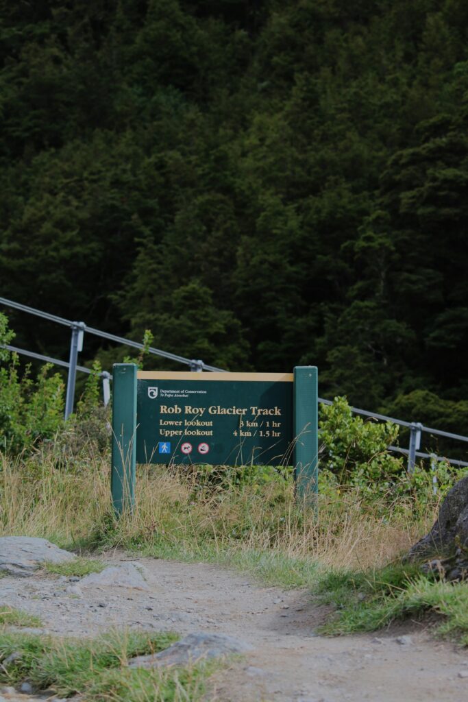 sign for rob roy glacier track, new zealand